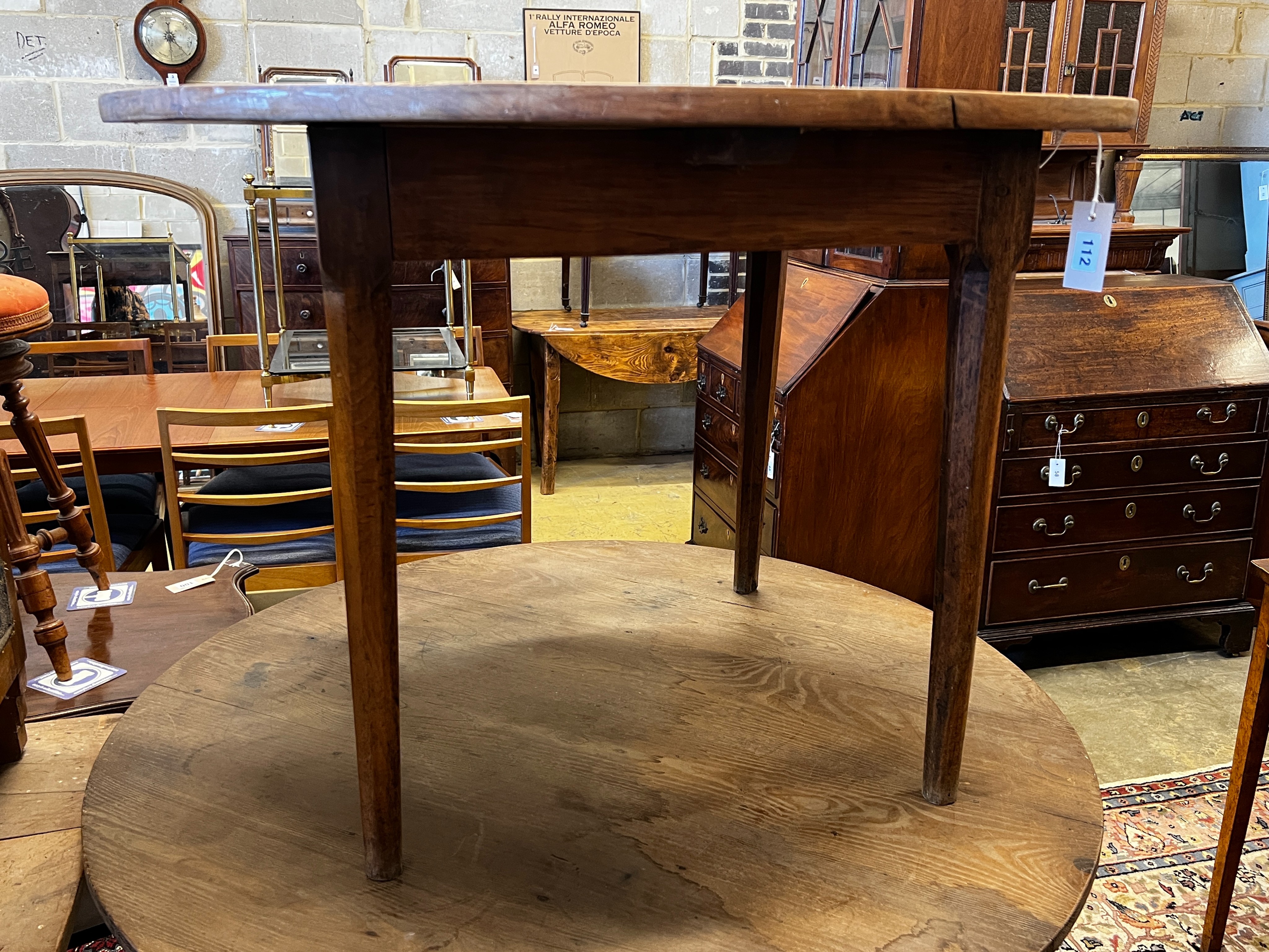 A 19th century French cherrywood circular table, diameter 100cm, height 71cm